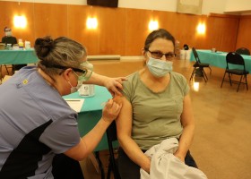 Hupacasath member Paulette Tatoosh receives her first COVID-19 shot, when NTC nurses brought Moderna doses to the House of Gathering on March 4, part of community immunization clinics being held across the province this month for on-reserve First Nations members. (Denise Titian photo) 